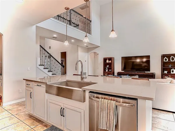 a kitchen with a sink and a refrigerator
