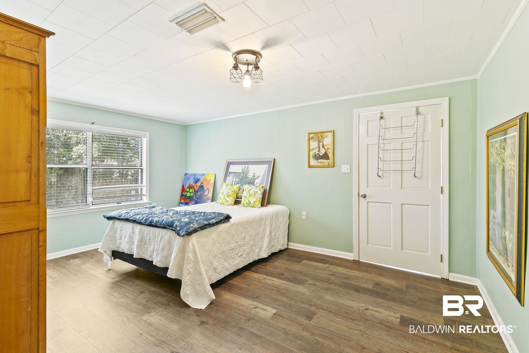 316 West Orchid Avenue Foley, AL 36535 - Photo 17 of 38 Bedroom featuring crown molding and dark wood-type flooring