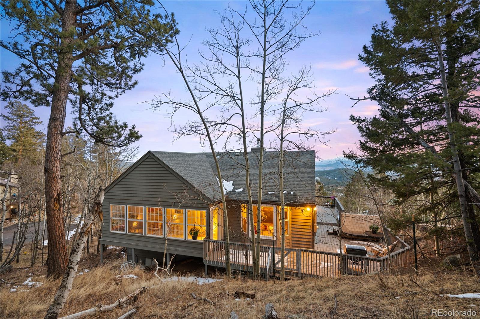 11740 Baca Road Conifer, CO 80433 - Photo 3 of 49 a view of a backyard with a large tree