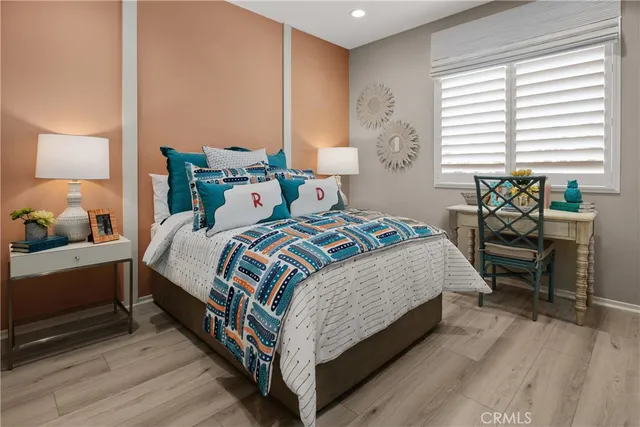 a bedroom with a bed and a table in it