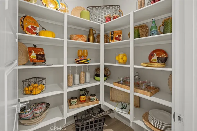 a room with a wooden floor and shoes