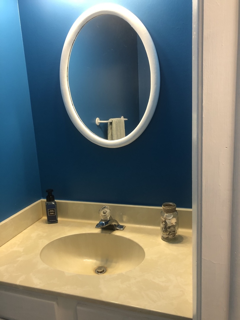 3644 Harlem Avenue Riverside, IL 60546 - Photo 27 of 35 a bathroom with a sink and mirror