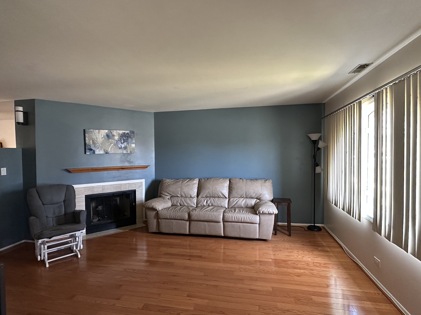 3644 Harlem Avenue Riverside, IL 60546 - Photo 6 of 35 a living room with furniture a fireplace and a large window