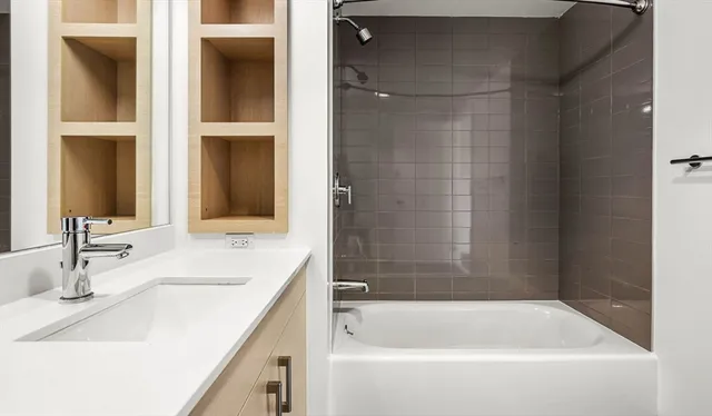 a bathroom with a bathtub and a sink