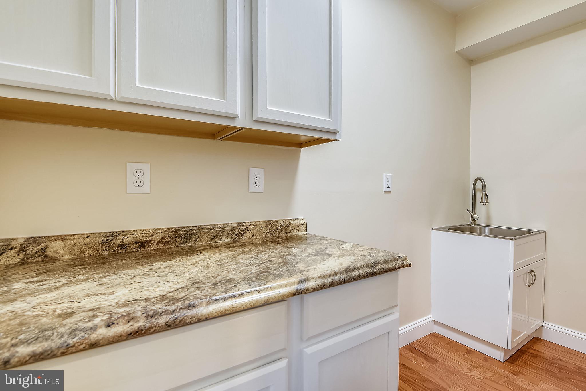4860 Friendship Acres Road Nanjemoy, MD 20662 - Photo 64 of 102 Utility room in basement with sink and cabinets