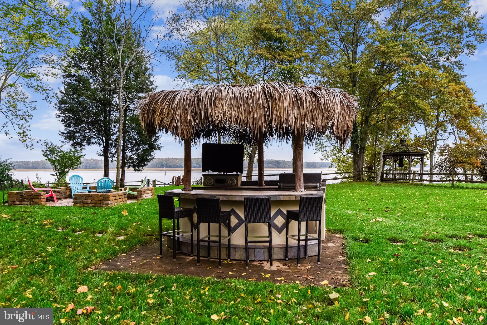 4860 Friendship Acres Road Nanjemoy, MD 20662 - Photo 74 of 102 Tiki bar with tv and refrigerator