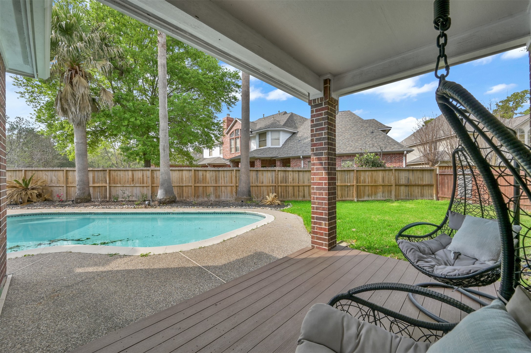9706 Chipstead Court Spring, TX 77379 - Photo 40 of 44 Now that we've seen the beautiful interior, let's head outside. Can't you just picture curling up in one of these chairs and taking this view in?