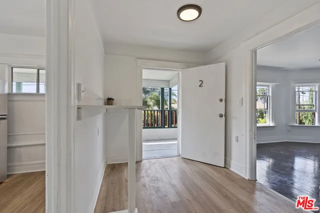 wooden floor with white walls