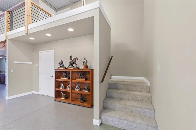 a view of a hallway with stairs