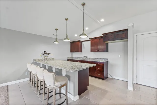 a kitchen with a table and chairs in it