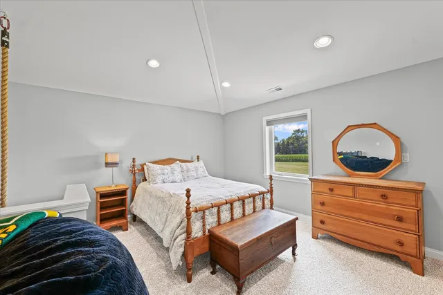 a bedroom with bed and a window