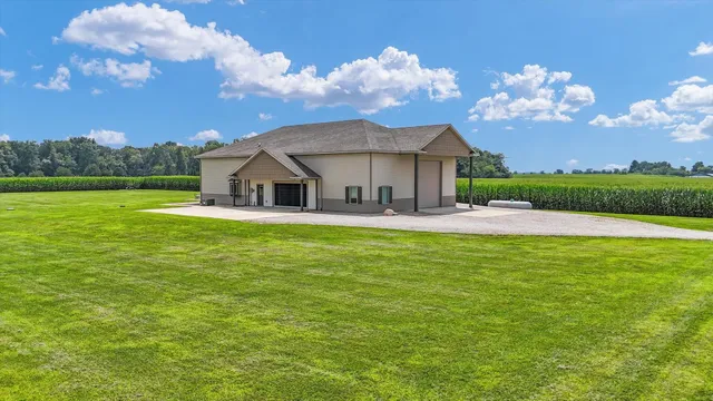 a house view with swimming pool and garden