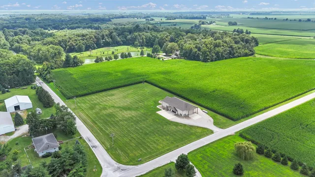 a view of a garden with a building in the background
