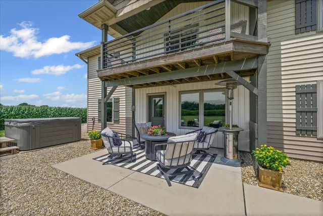 a view of a house with backyard sitting area and garden