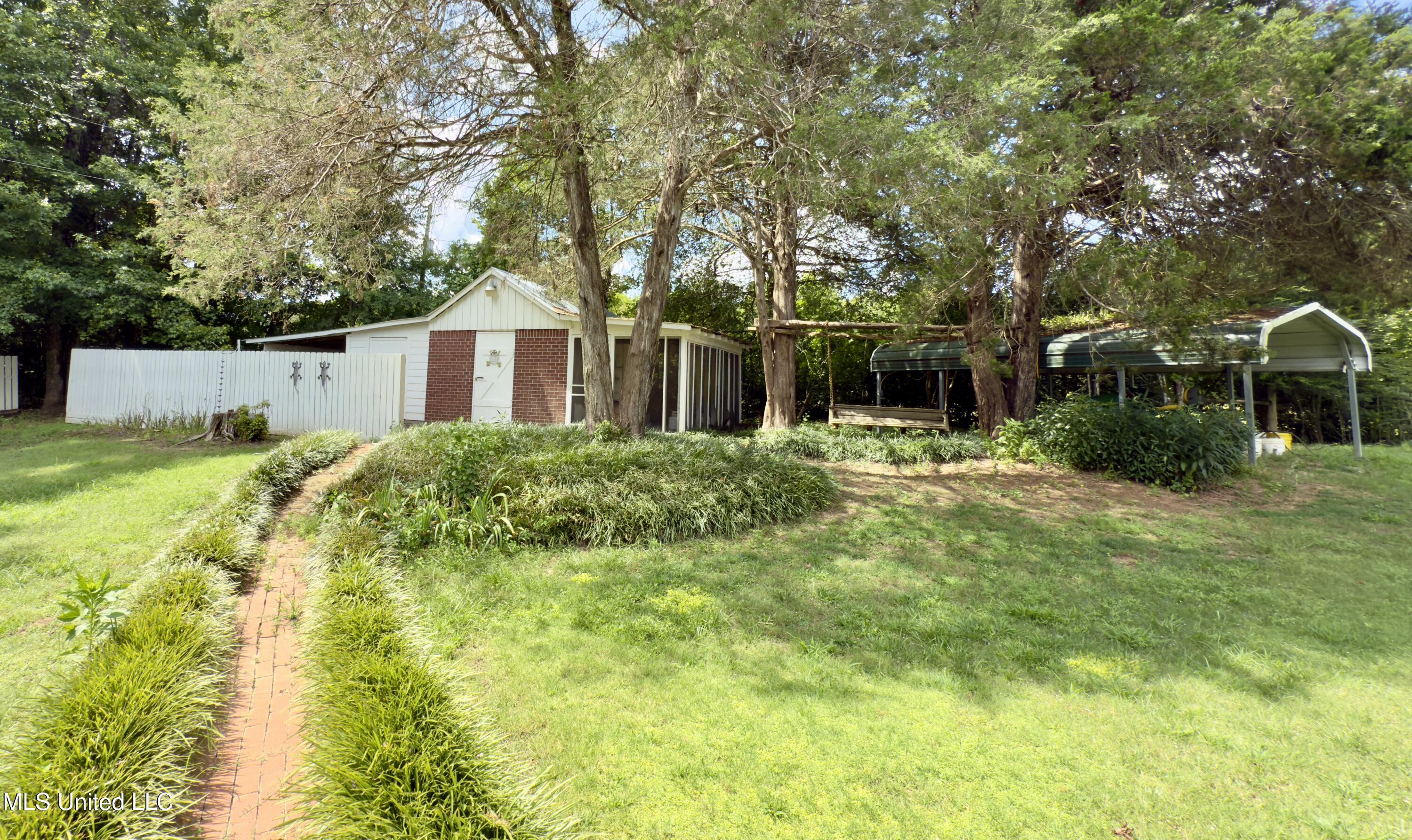 19 Peel Lane Holly Springs, MS 38635 - Photo 26 of 27 Backyard/Shed