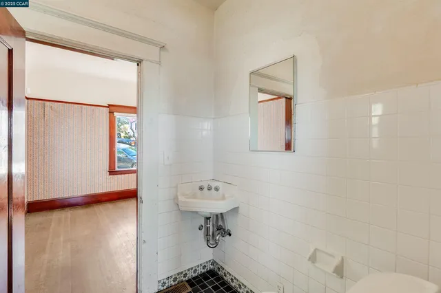 a view of an entryway with wooden floor and a window