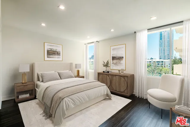 a bedroom with a bed and a couch