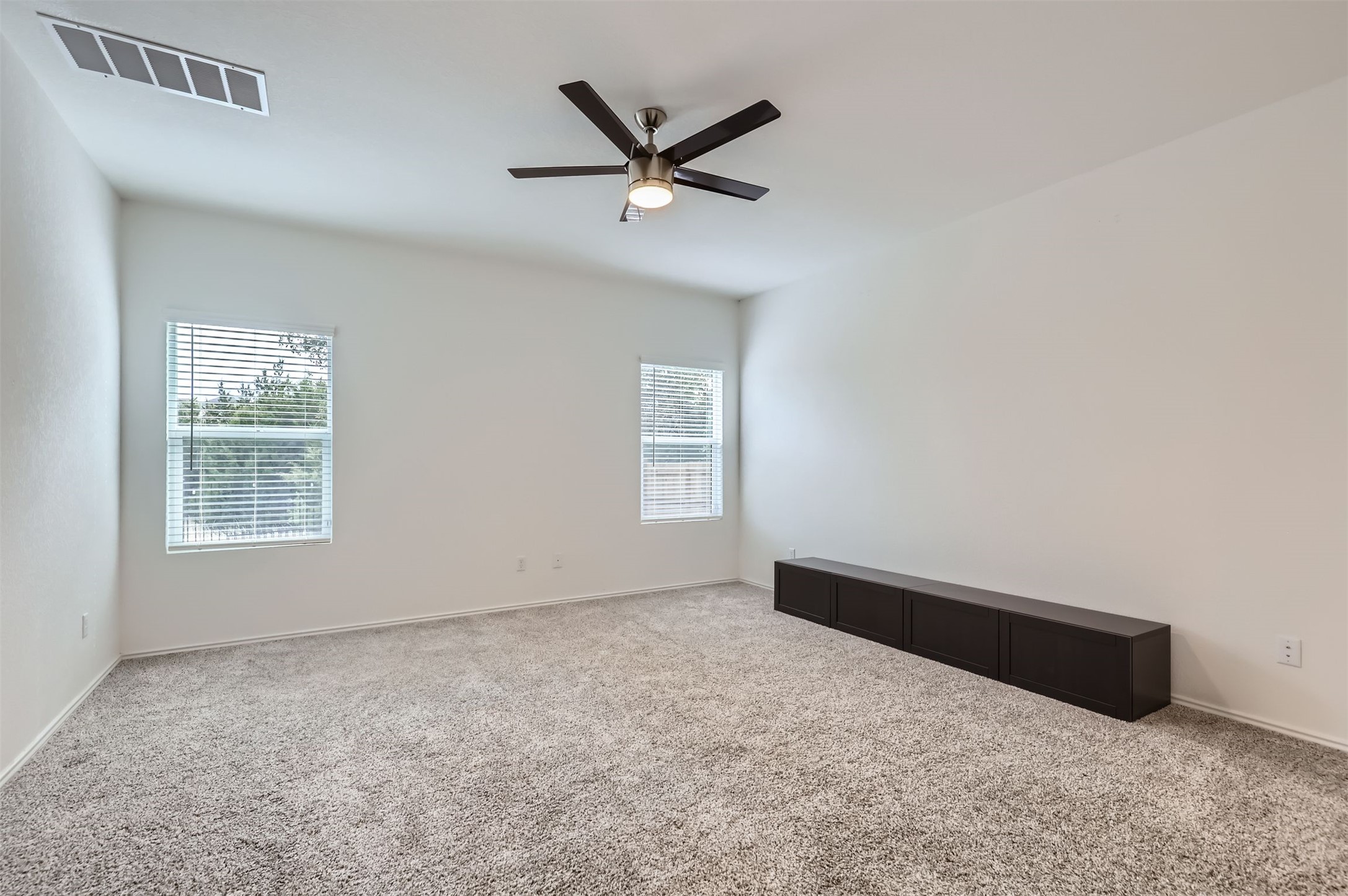 1632 Woolsey Way Leander, TX 78641 - Photo 12 of 29 Primary bedroom faces the backyard.