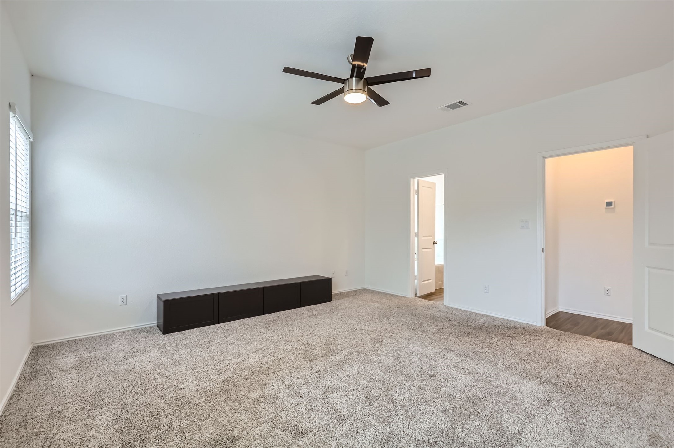1632 Woolsey Way Leander, TX 78641 - Photo 13 of 29 Large primary bedroom.