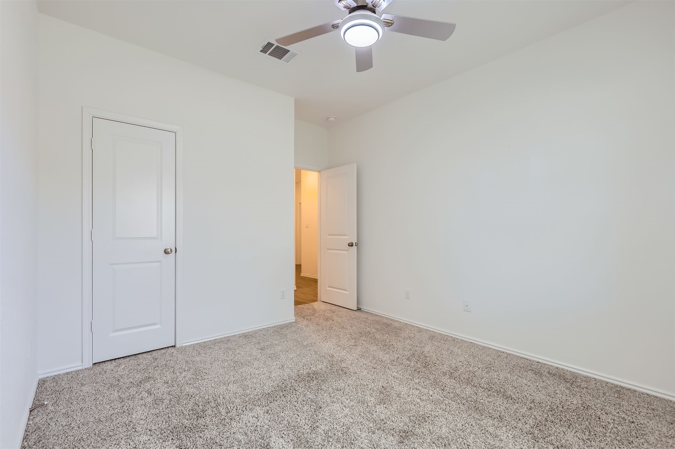 1632 Woolsey Way Leander, TX 78641 - Photo 23 of 29 Bedroom 3 with walk in closet and ceiling fan.