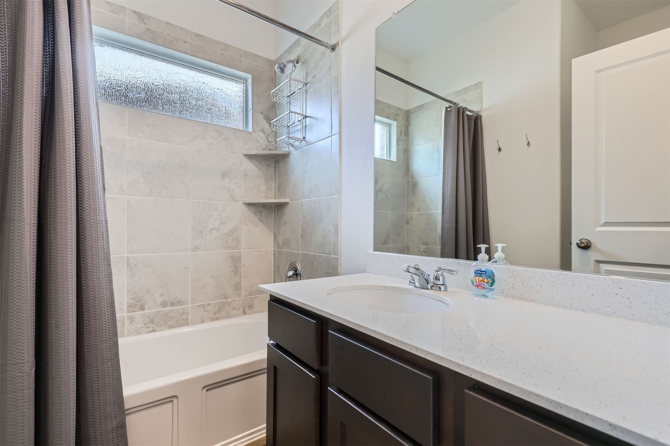 1632 Woolsey Way Leander, TX 78641 - Photo 24 of 29 Bathroom with vanity and shower/bath combo.