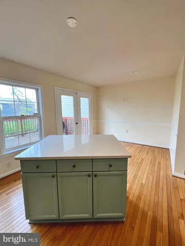 a room with a wooden floor and furniture