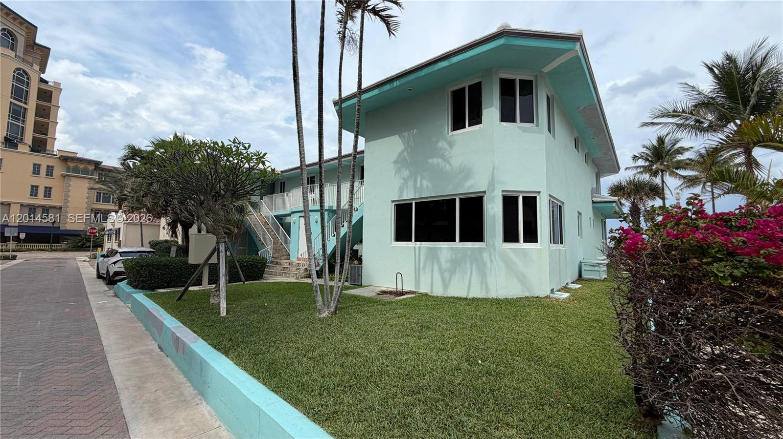 3400 North Surf Road, Unit 1 Hollywood, FL 33019 - Photo 14 of 14 a front view of a house with a yard