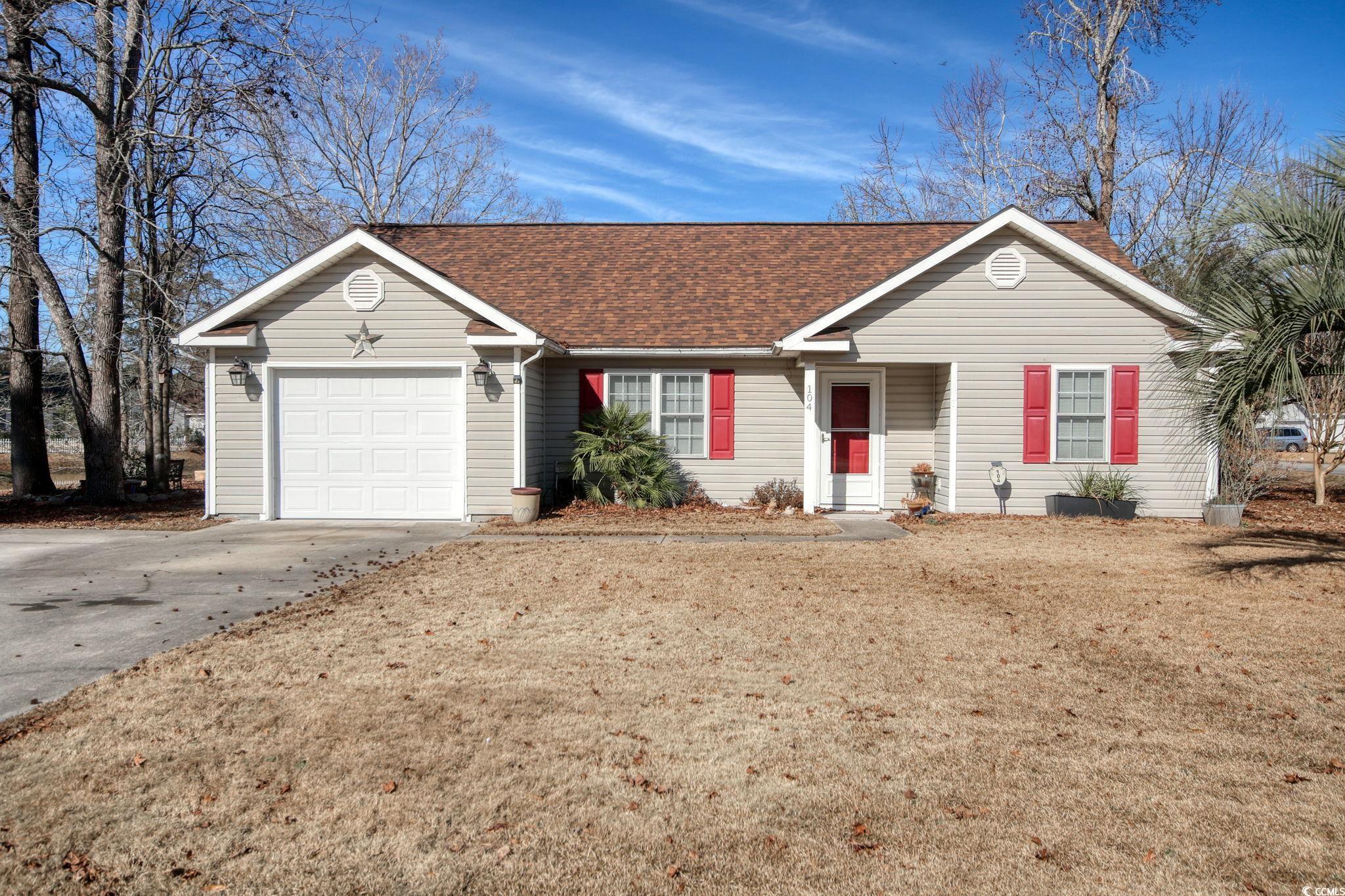104 Osprey Cove Loop Myrtle Beach, SC 29588 - Photo 1 of 35 Ranch-style house featuring a front yard and a gar