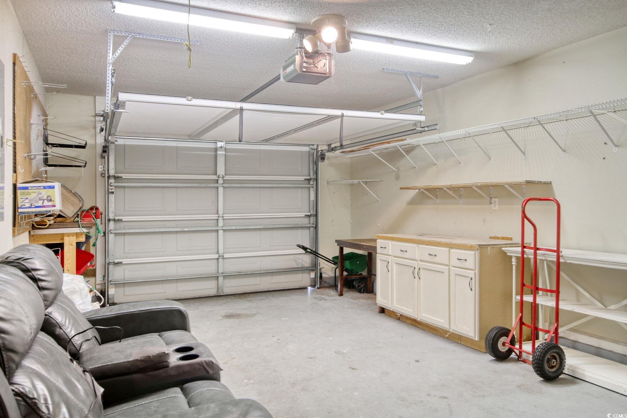 104 Osprey Cove Loop Myrtle Beach, SC 29588 - Photo 14 of 35 Garage with a garage door opener