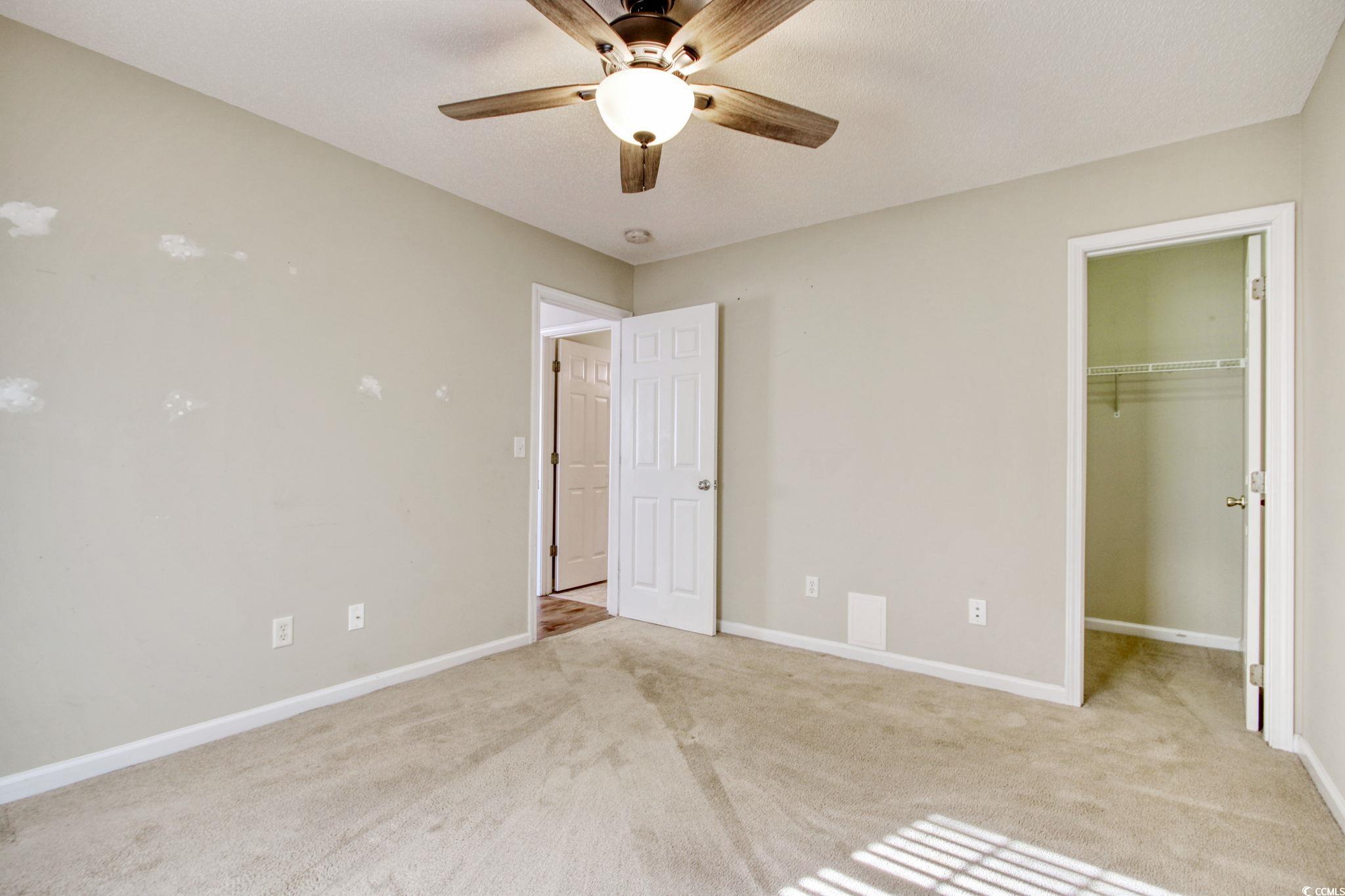 104 Osprey Cove Loop Myrtle Beach, SC 29588 - Photo 18 of 35 Unfurnished bedroom featuring ceiling fan, light c