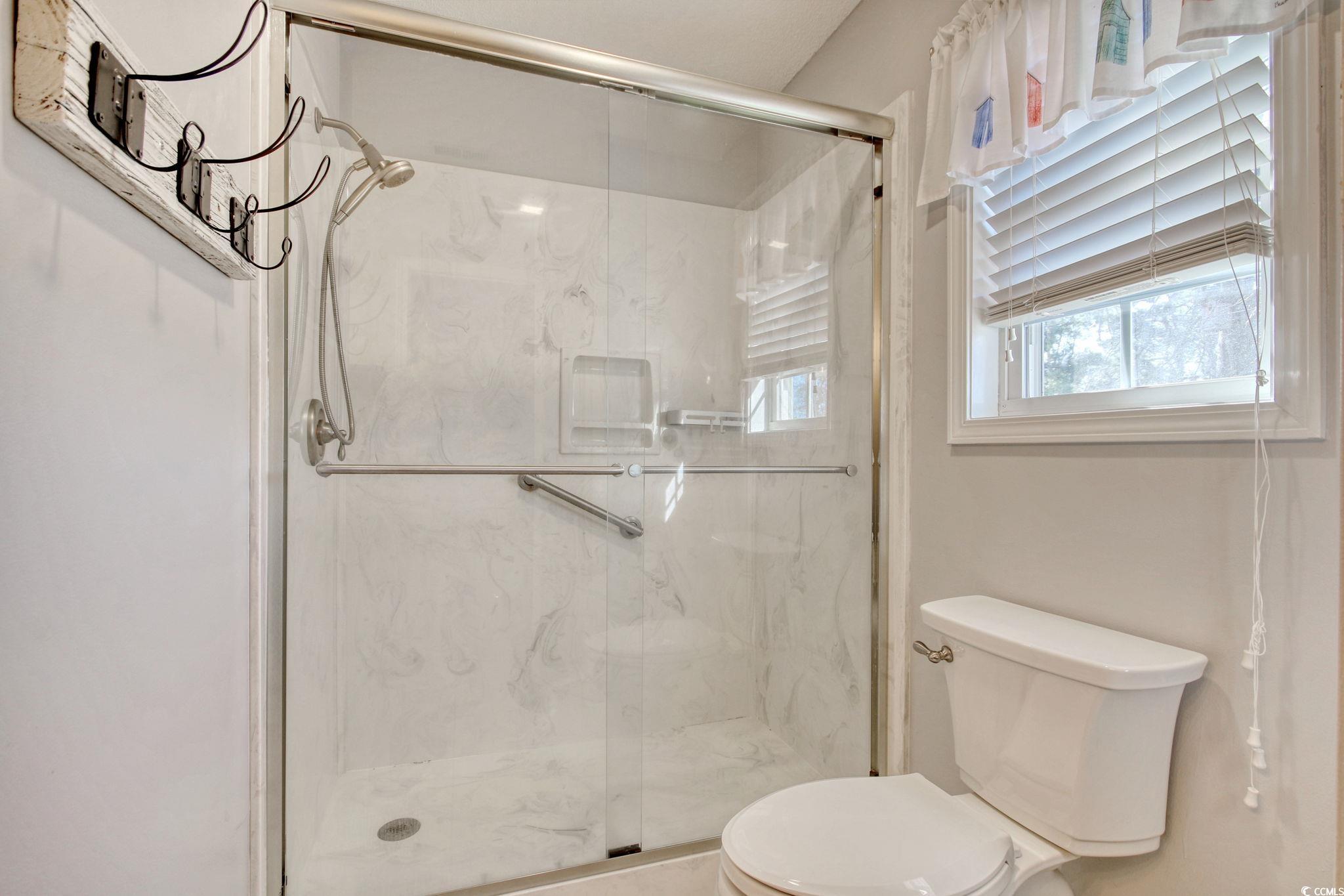 104 Osprey Cove Loop Myrtle Beach, SC 29588 - Photo 23 of 35 Bathroom featuring toilet and walk in shower