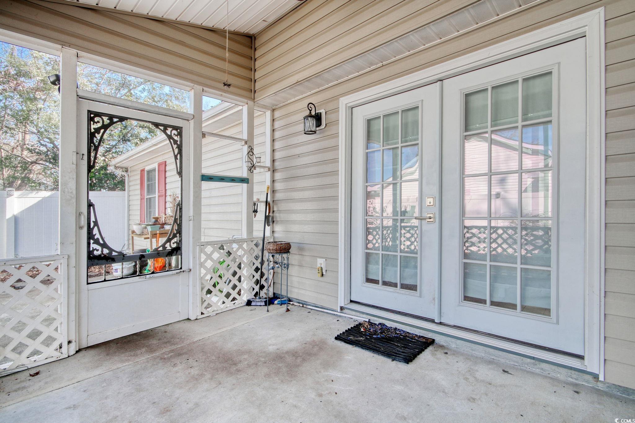 104 Osprey Cove Loop Myrtle Beach, SC 29588 - Photo 25 of 35 Unfurnished sunroom with lofted ceiling and a heal
