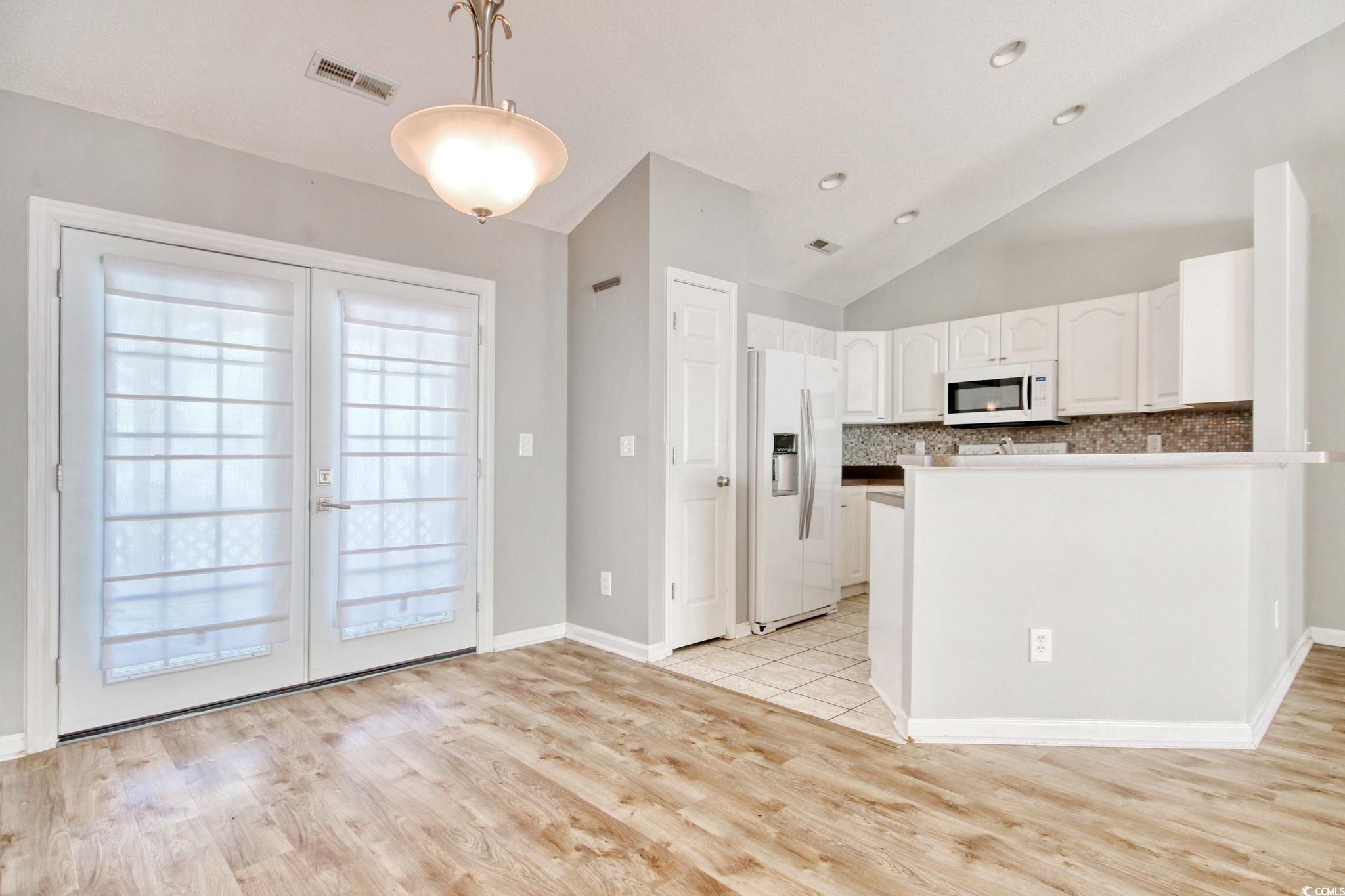 104 Osprey Cove Loop Myrtle Beach, SC 29588 - Photo 8 of 35 Kitchen with pendant lighting, refrigerator with i
