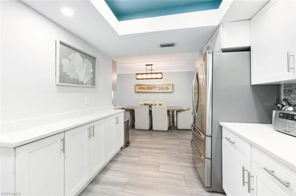 a bathroom with a sink a mirror and a bathtub