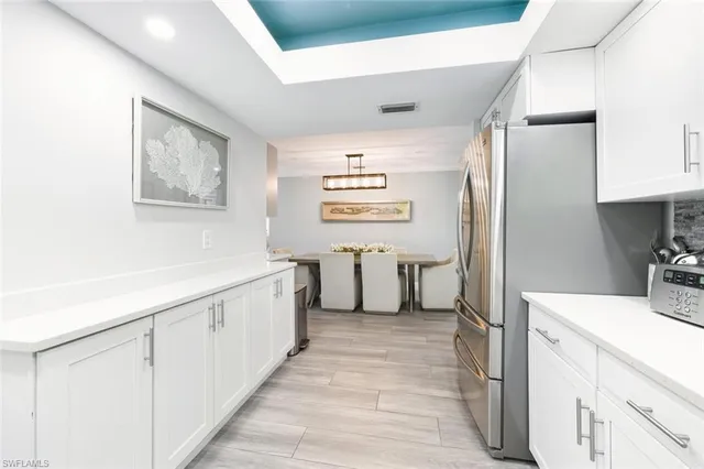 a bathroom with a sink a mirror and a bathtub