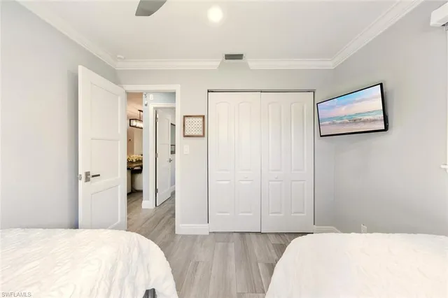 a bedroom with a bed and cabinets