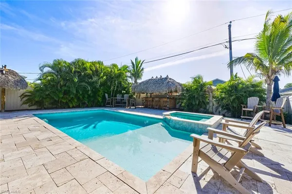 a view of a swimming pool with a patio