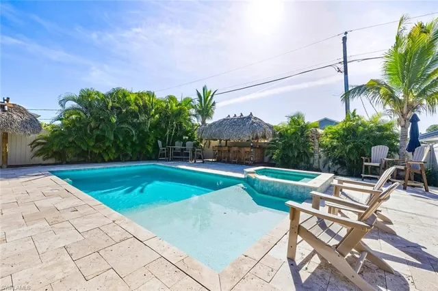 a view of a swimming pool with a patio