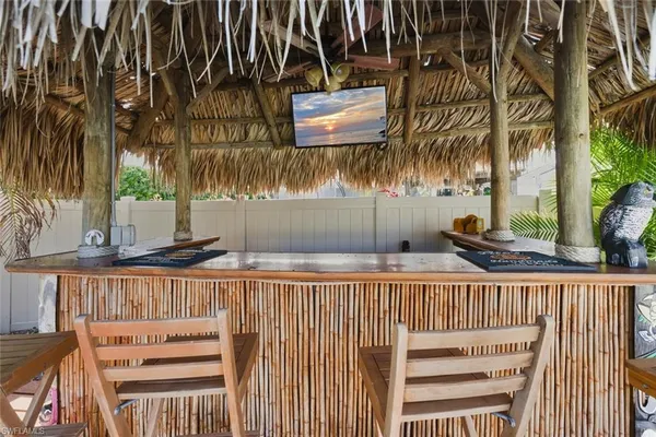 a backyard of a house with table and chairs