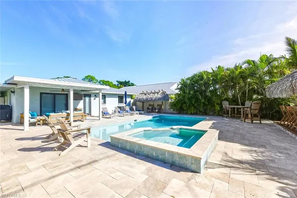 a view of an chairs and tables in patio