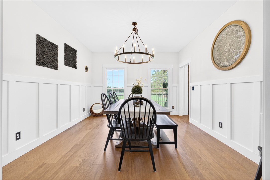 5016 Copeland Road Belton, SC 29627 - Photo 7 of 45 Board and batten wainscoting and hardwood floors frame this delightful dining room.