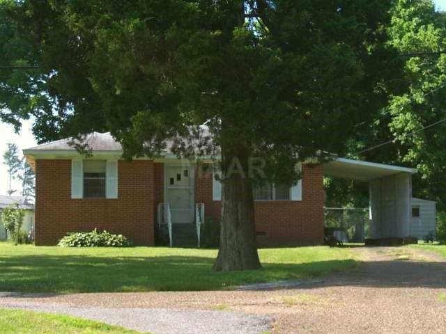 11381 Macon Road Eads, TN 38028 - Photo 3 of 21 a front view of a house with a yard and garage