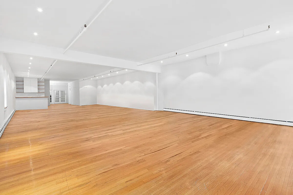471 Broadway, Unit 3 Manhattan, NY 10013 - Photo 3 of 10 a view of an empty room with wooden floor