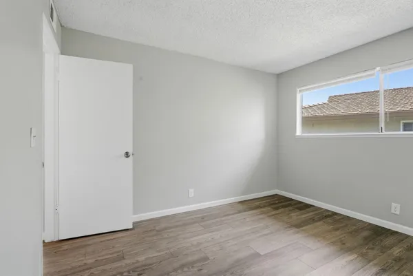 a view of a room that has wooden floor in it