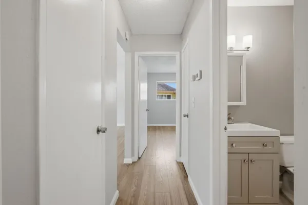 a view of a bathroom from a hallway