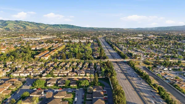 a aerial view of a house with a yard