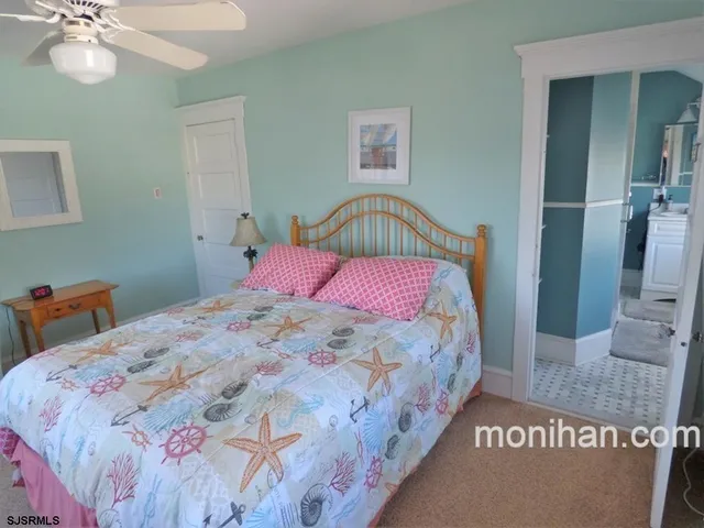 a bedroom with a bed and a table