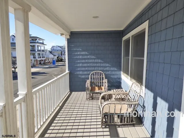 a view of balcony with wooden floor
