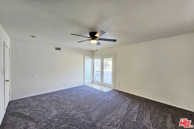 a bathroom with a sink a mirror and shower