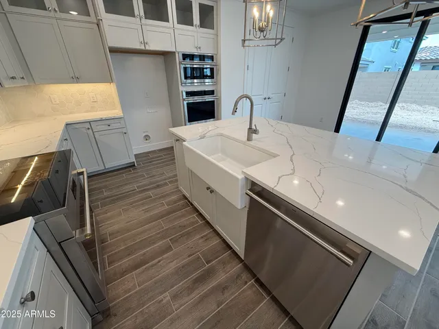 a bathroom with a sink and a large mirror